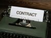 Smart Contract Security – Audits, Formal Verification, and Testing a close up of a typewriter with a sign that reads contact