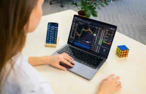 Building and Using Automated Crypto Trading Bots a woman sitting at a table using a laptop computer