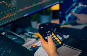 How to Choose a P2P Crypto Platform – Safety, Escrow and Reputation Trader analyzing stock market charts on computer screens with calculator.