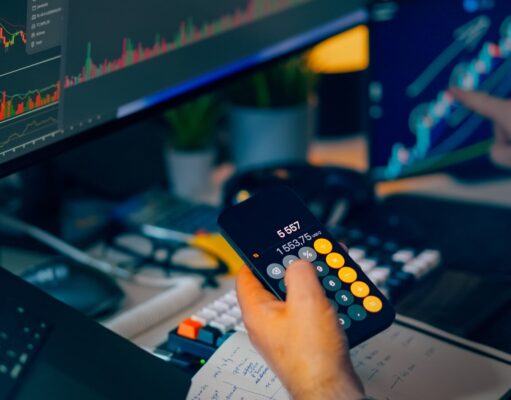 How to Choose a P2P Crypto Platform – Safety, Escrow and Reputation Trader analyzing stock market charts on computer screens with calculator.