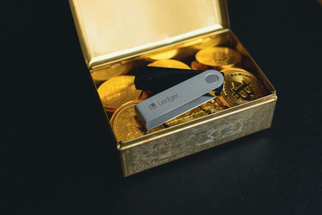 Photo by rc.xyz NFT gallery a swiss army knife sitting in a box of gold coins