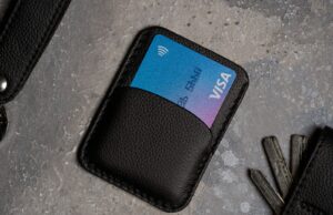 Multisig Wallets and Advanced Security for Investors a black wallet with a credit card and keys
