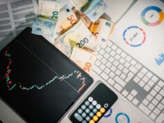 Top 10 Cryptocurrency Platforms Compared – Fees, Security, and User Experience A calculator sitting on top of a pile of money