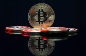 Maximizing Referral Programs and Sign-Up Bonuses a bit coin sitting on top of a table