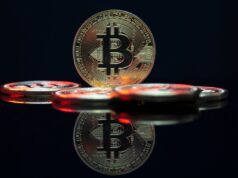 Tokenizing Real-World and Digital Assets for Profit a bit coin sitting on top of a table