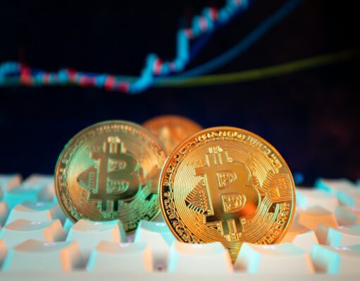 US-Friendly Crypto Exchanges – Compliance, Availability and Reviews Bitcoin coins are displayed with a stock chart.