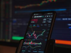 How Macroeconomics and Interest Rates Impact Crypto Prices black android smartphone on brown wooden table