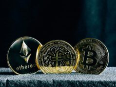 Understanding Blockchain – The Foundation of Cryptocurrency Investing three bitcoins sitting on top of a table