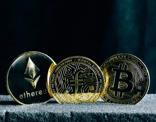 Understanding Blockchain – The Foundation of Cryptocurrency Investing three bitcoins sitting on top of a table