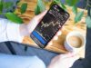 Trading Crypto Futures and Options for Income a person holding a cell phone in their hand