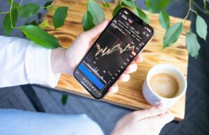 Trading Crypto Futures and Options for Income a person holding a cell phone in their hand